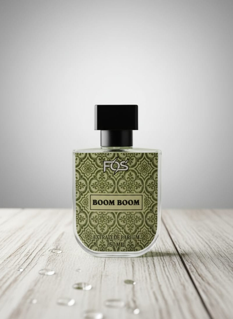 Perfume bottle labeled 'BOOM BOOM' by FOS on a wooden surface with a gray background