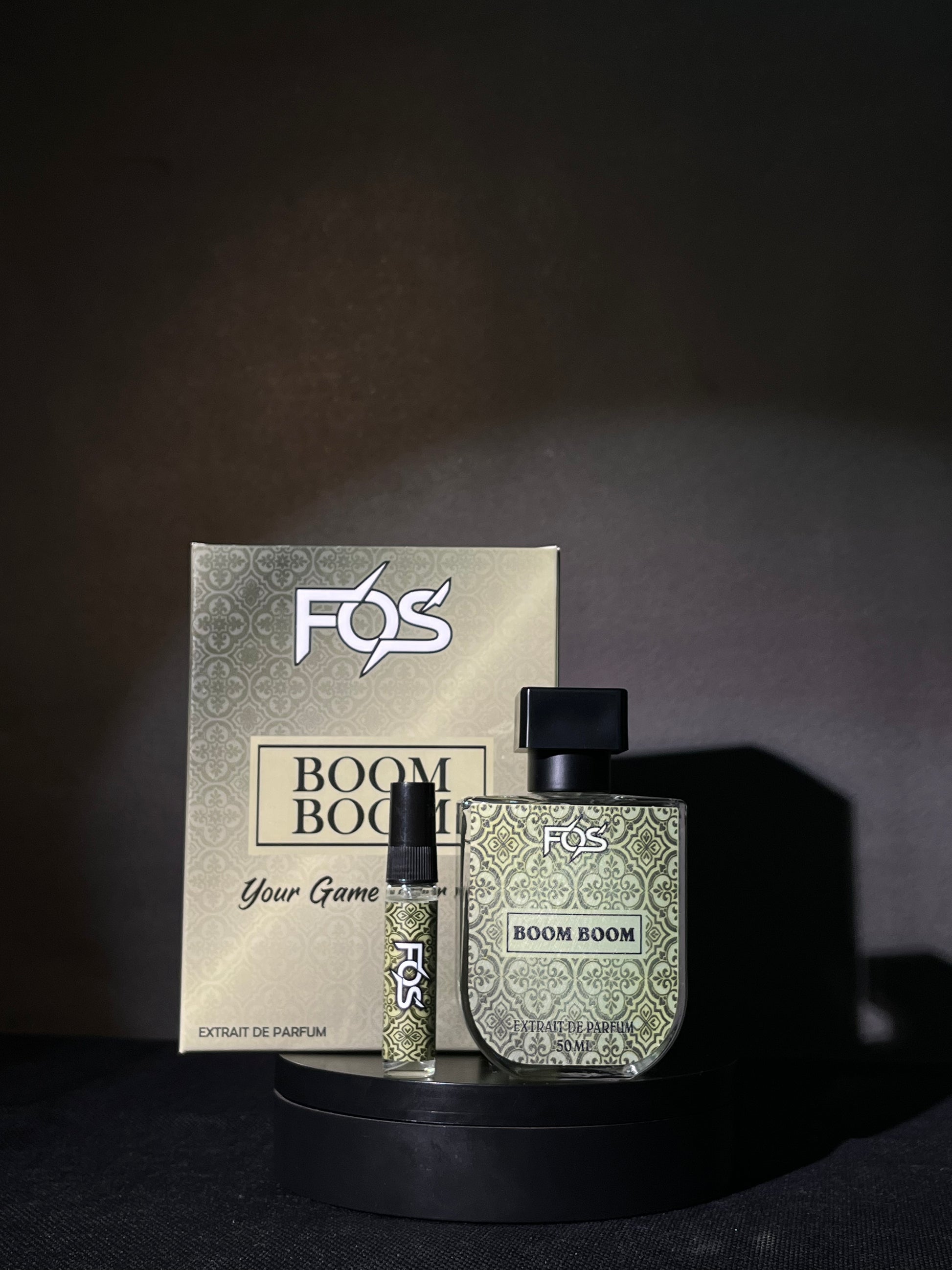 FOS Boom Boom perfume set with packaging on a dark background