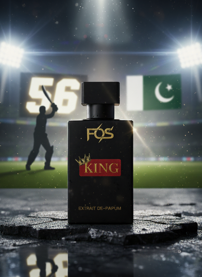 FOS King perfume bottle on a sports field with stadium lights and a player in the background