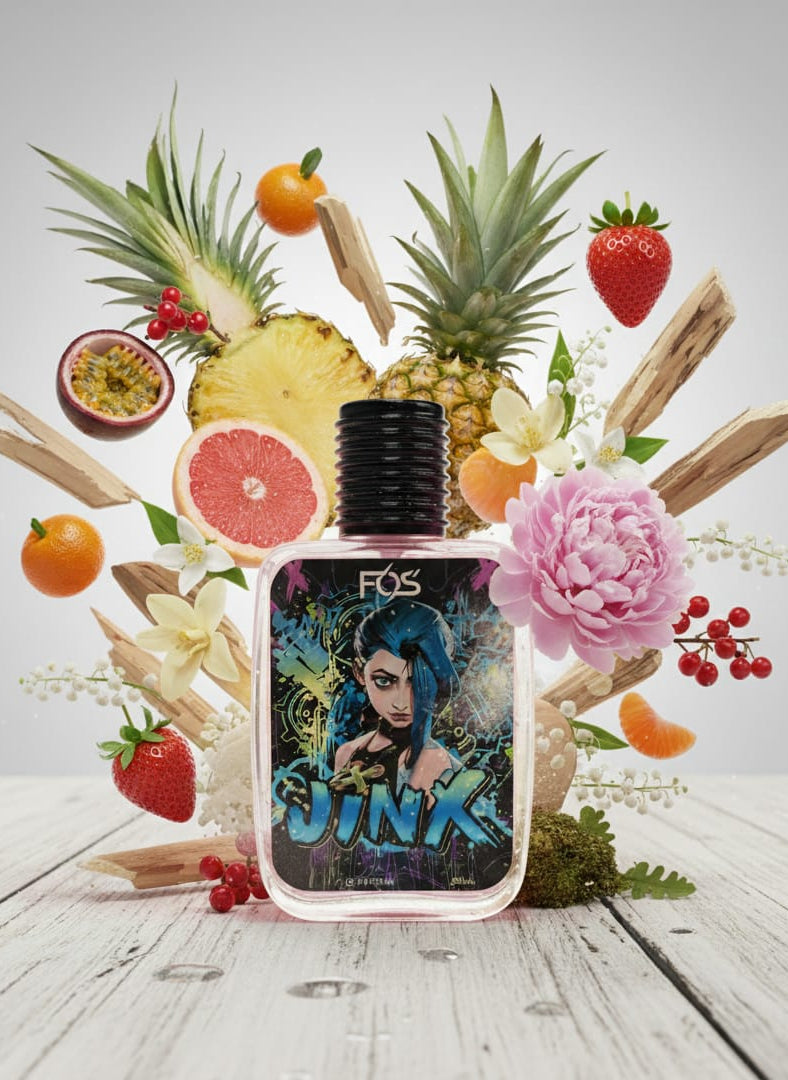 Perfume bottle with fruit and floral elements on a light background
