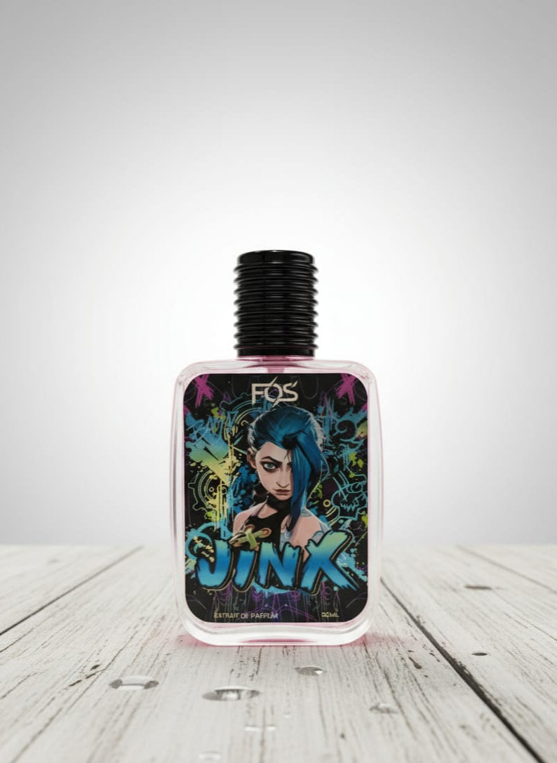 Perfume bottle with colorful label featuring a character and the word 'Jinx' on a wooden surface.